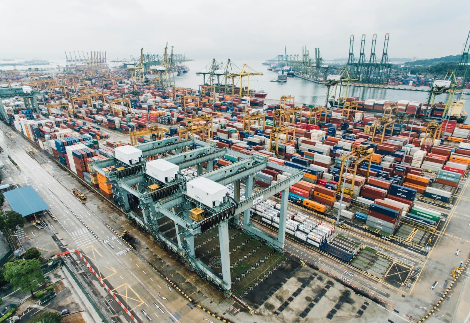 Aerial view of a container terminal with stacked intermodal containers and gantry cranes